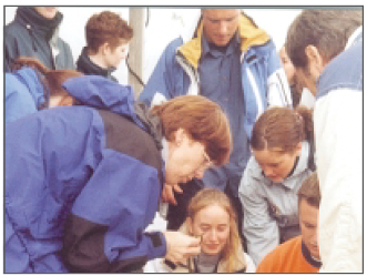 Teacher showing students the VIRTUE racks in Baltimore